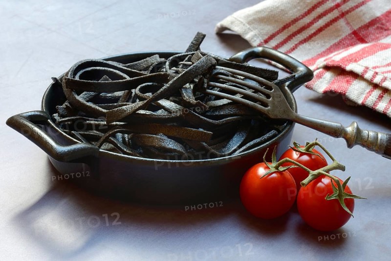 Black pasta coloured with squid ink in shell, Taglioni al Nero di Seppia, Italy, Europe