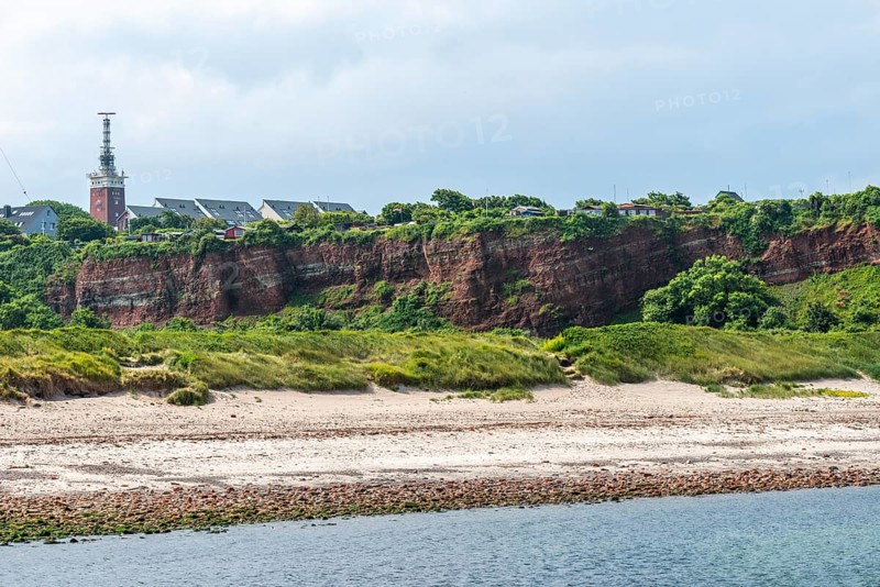 View over the northern beach, red sandstone cliff on the offshore island of Heligoland, allotment gardens on the cliff edge in the Oberland, brick lighthouse, North Sea, Pinneberg district, Schleswig-Holstein, Germany, Europe
