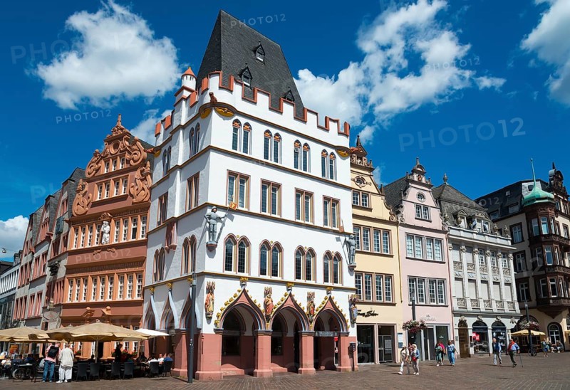 Historic old town with half-timbered houses, blue sky and cafés, animated by tourists under summer sunshine, in the centre Haus Steipe with arcade and battlements, Hauptmarkt, Trier, Rhineland-Palatinate, Germany, Europe