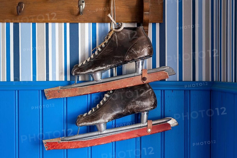 Old leather skates on a blue wall, Naantali or Nådendal, Baltic Sea coast, Finland, Europe