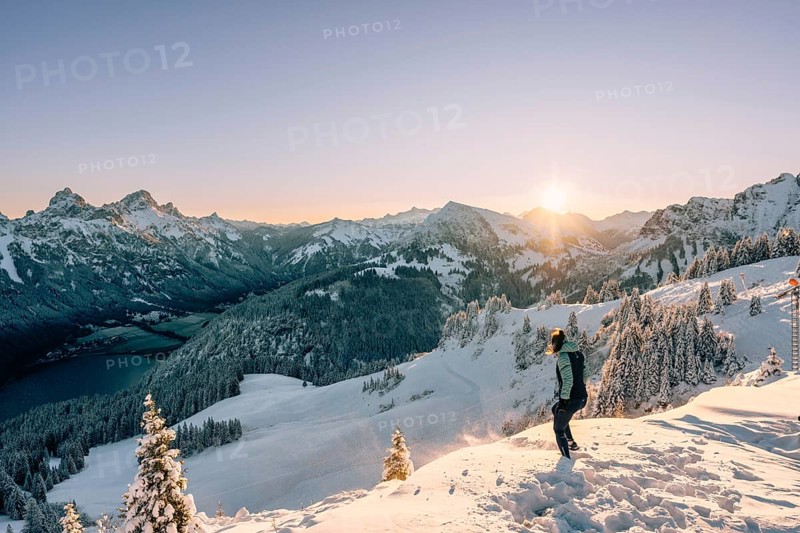 Hiking in the snow in the snow-covered winder landscape in the Alps at Neunerköpfle in the Tannheimer Tal in Tyrol, Austria, Europe