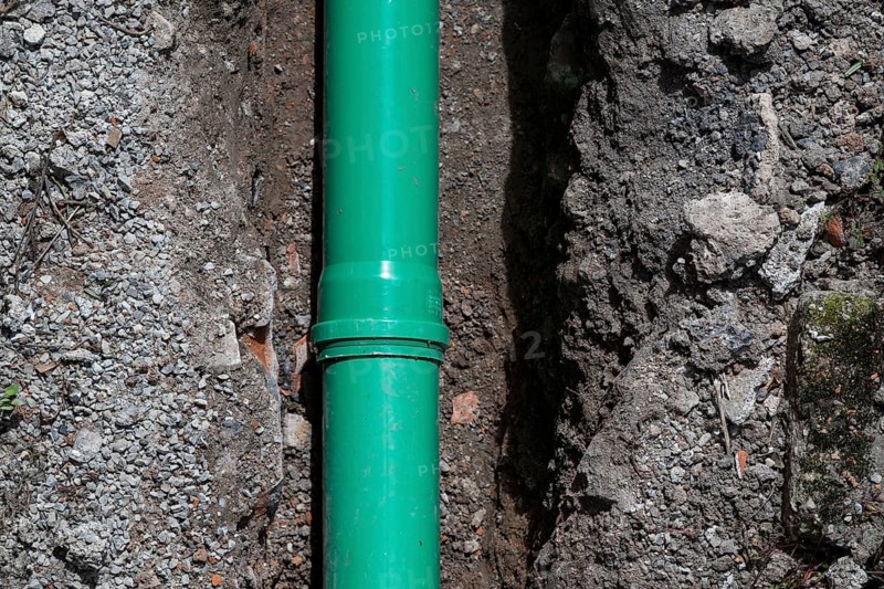 Newly laid green sewage pipe in a trench, Stuttgart, Baden-Württemberg