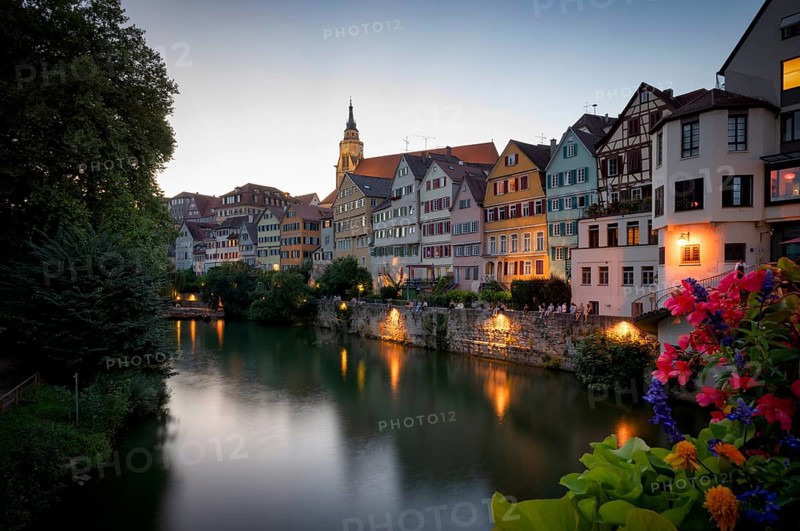 View in summer from the Neckar bridge onto the Neckar front with historic buildings, collegiate church and Hölderlin tower, evening, twilight, atmospheric, blue hour, Tübingen, Baden-Württemberg, Germany, Europe