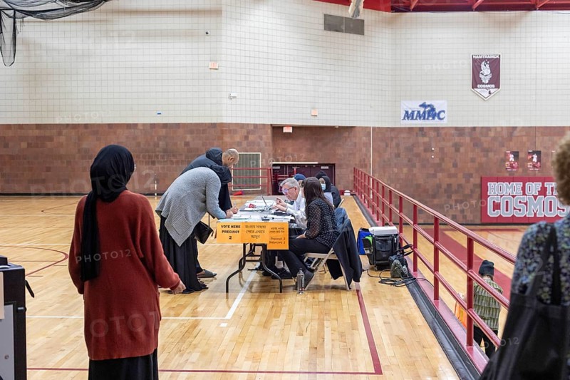 Hamtramck, Michigan USA, 27 February 2024, People check in to vote at Hamtramck High School in Michigan's Presidential primary election. Especially in Hamtramck and Dearborn, where there are large numbers of Arab-Americans, many voters planned to vote uncommitted in the Democratic primary.. Many Arab-Americans are furious about Joe Biden's support for Israel in the Gaza war. Israel's bombing there has cost tens of thousands of Palestinian lives
