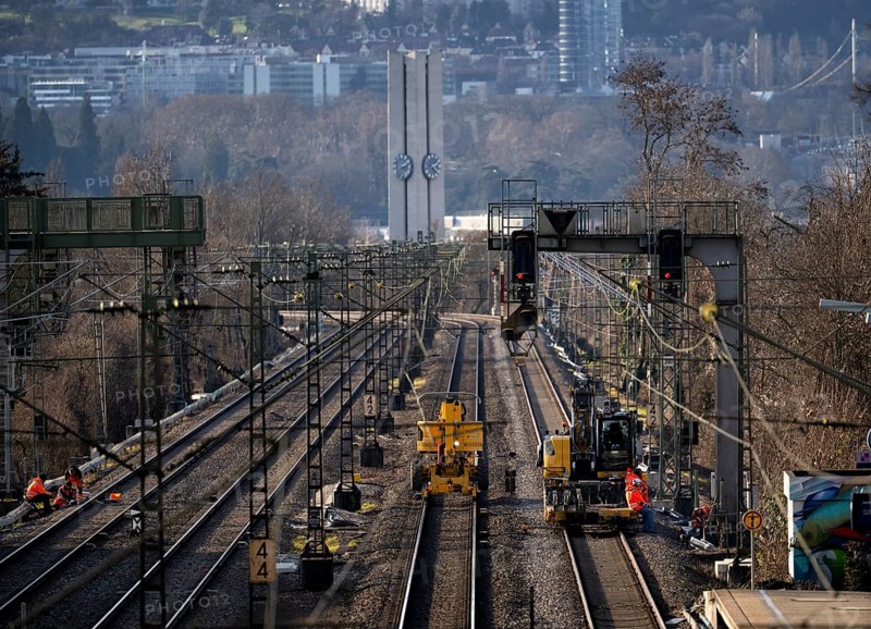 Labourers working with Liebherr A922 Rail Litronic and Kuhnle RR14 EVO 3 Rail two-way working platform on rails, line closure, construction site implementation of digital node between Waiblingen and Bad Cannstatt, Evangelische Stephanuskirche, Stuttgart, Baden-Württemberg, Germany, Europe