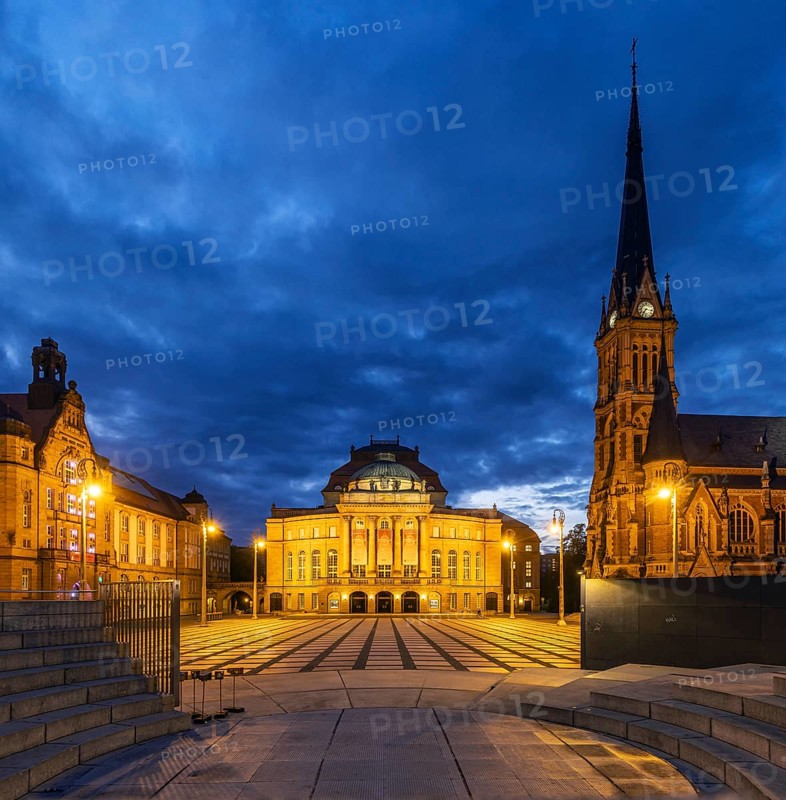 Sights on Theatre Square at night: Opera House, Petrikirche, Hotel Chemnitzer Hof in Bauhaus architectural style. City view of Chemnitz, Saxony, Germany, Europe