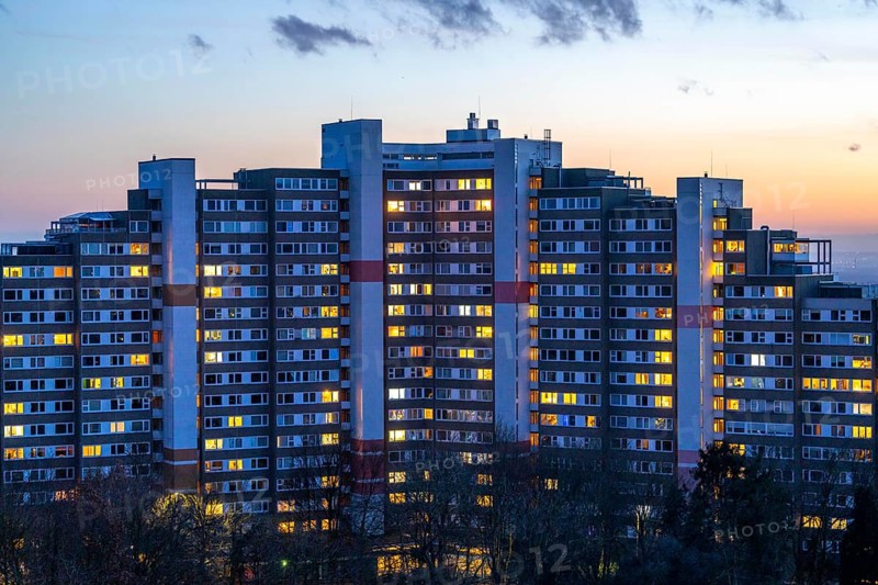 High-rise buildings in the Bensberg residential park, Bergisch-Gladbach, 18-storey housing estate with over 900 flats spread over 7 building complexes, dusk, illuminated windows, North Rhine-Westphalia, Germany, Europe
