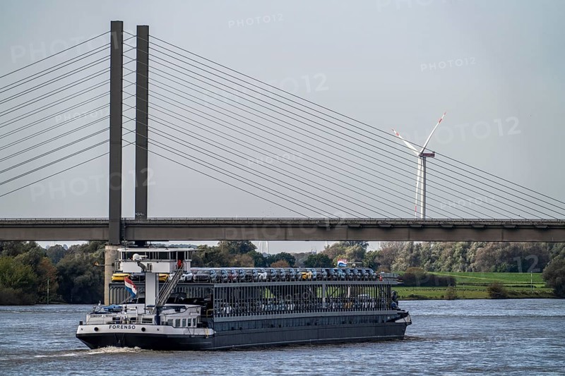 Car transporter Freighter Forenso, on the Rhine near Rees, brings Ford Explorer e-cars from the Cologne Ford plant to the seaports of the Netherlands for onward transport overseas, Rhine bridge Rees-Kalkar, North Rhine-Westphalia, Germany, Europe