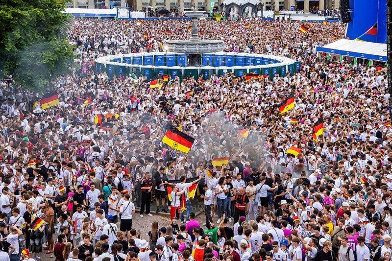 UEFA European Football Championship. Enthusiastic fans at the public viewing in the host city of Stuttgart under the motto: the whole city is one stadium. 30, 000 football fans with German flags on the Schlossplatz in Stuttgart, Baden-Württemberg, Germany, Europe