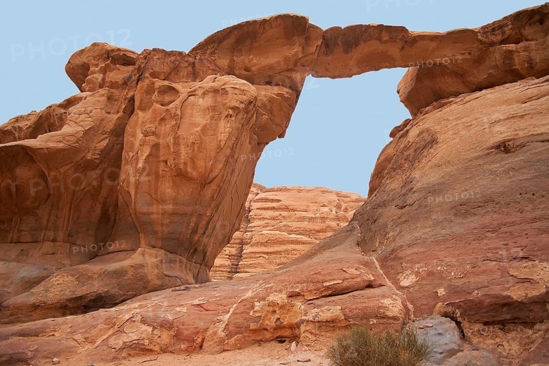 Jabal Umm Fruth rock bridge, one of several natural arches in the Wadi Rum desert, the Valley of the Moon in southern Jordan