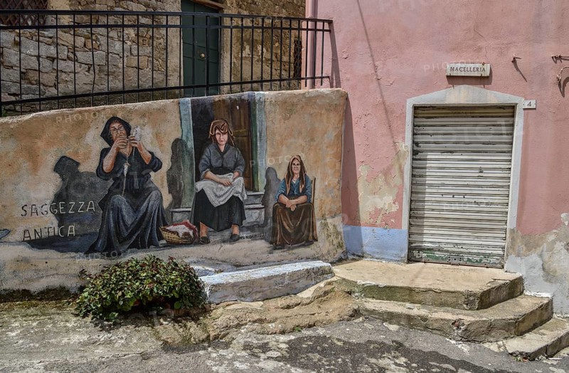 Mural of Sardinian women, village life, artist Pasqualino Baingiu, Orgosolo, Province of Nuoro, Sardinia, Italy, Europe