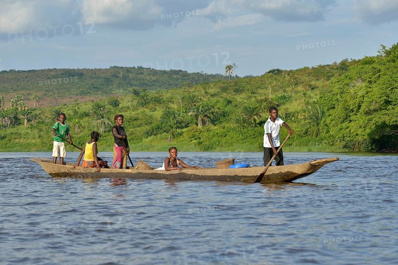 Fisher family on a pirogue on the Congo River, near Tshumbiri, Bandundu Province, Congo, Africa