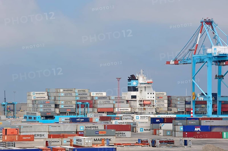 Crane loading of a container ship at the container terminal in the port of Zeebrugge, Belgium, Europe