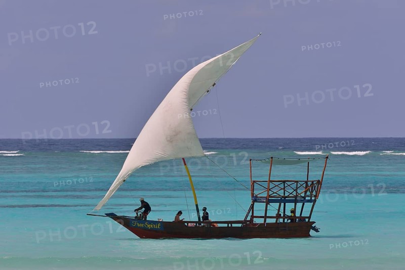 Dhow sailing on turquoise waters, Dongwe, Zanzibar, Tanzania, Africa