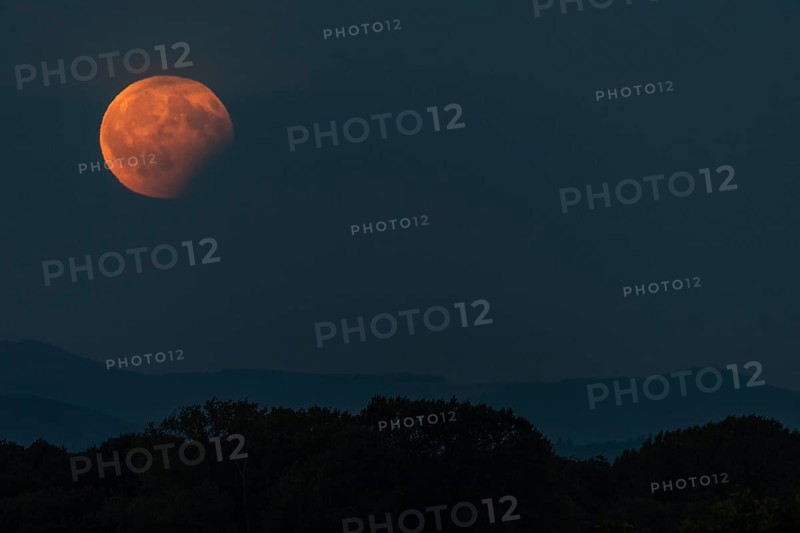 Partial lunar eclipse, the shadow of the earth is projected onto the moon. Bas-Rhin, Collectivite europeenne d'Alsace, Grand Est, France, Europe