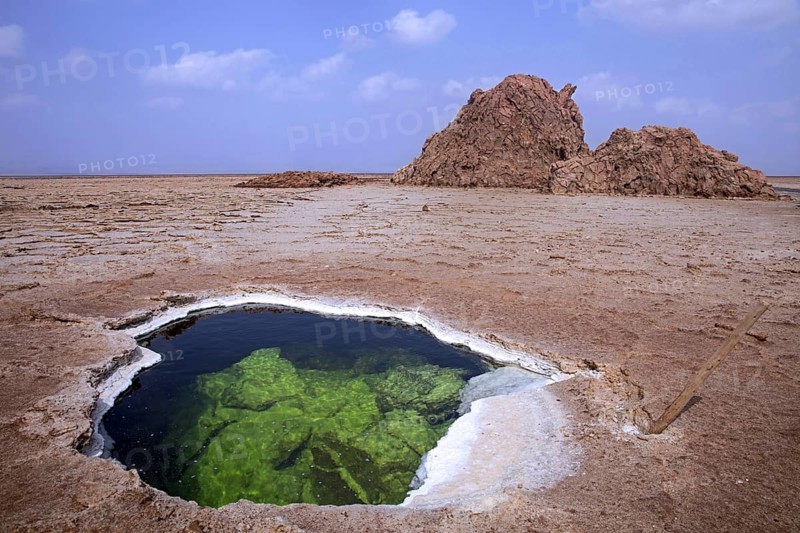 Lake formed in hole in salt layer in desert of the Danakil Depression, lowest and hottest place on Earth, Afar Region, Ethiopia, Africa