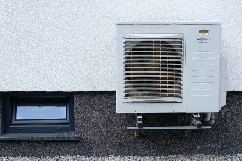 Heat pump on a house wall, North Rhine-Westphalia, Germany, Europe