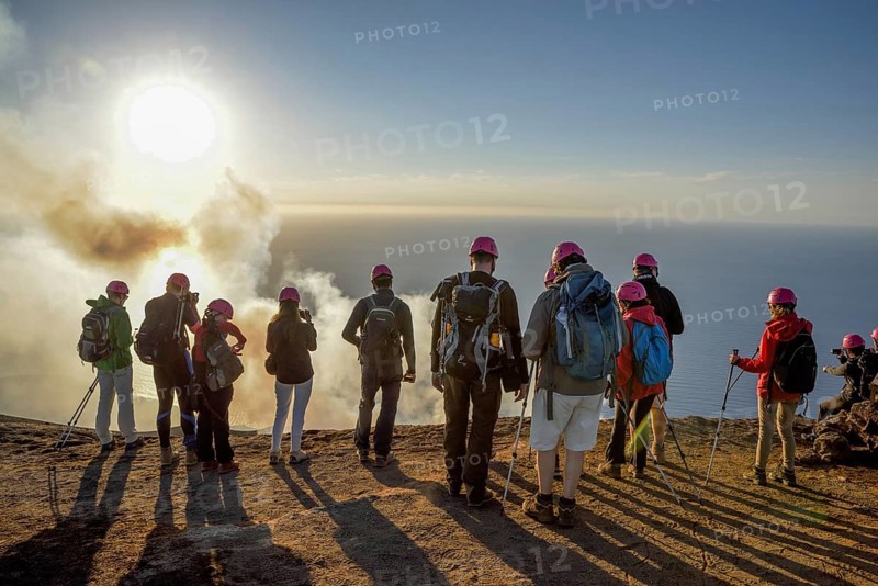 Tourists at the crater edge of the smoking layer volcano Stromboli, island Stromboli, Liparian Islands, Italy, Europe