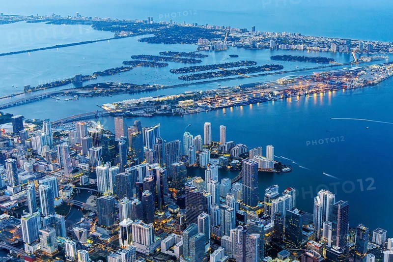 Aerial view of Miami skyline with skyscrapers Downtown Brickell and Miami Beach at night in Miami, USA, North America