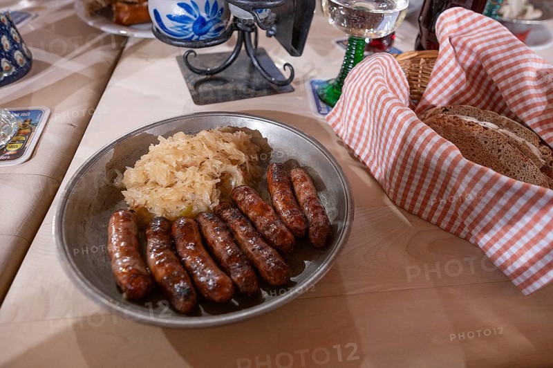 Nuremberg sausages with sauerkraut served on a pewter plate, Nuremberg, Middle Franconia, Bavaria, Germany, Europe