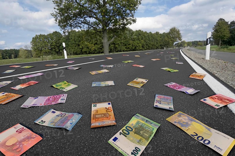 Symbolic image on the subject of subsidies, waste of money, money for road construction, etc