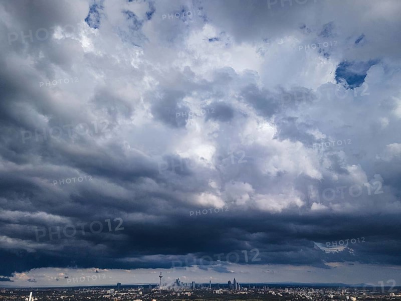 Heavy rain clouds pass over Frankfurt am Main and the banking skyline. The weather is expected to remain unstable and changeable in the coming days this summer. (Aerial photo with a drone), Frankfurt am Main, Hesse, Germany, Europe