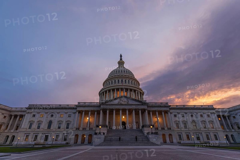 Violet sunset sky over the US Capitol building dome