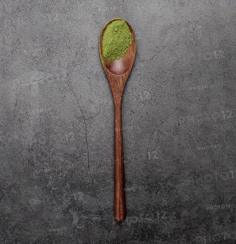 Flat lay matcha tea powder wooden spoon
