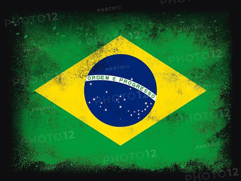 Brazil Flag design composition of exploding powder and paint, isolated on a black background for copy space. Colorful abstract dust particles explosion. World cup 2022 football symbol for printing