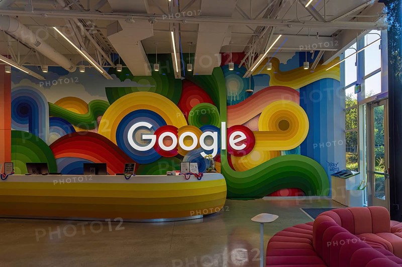 Google sign on the wall behind the reception desk at the Google headquarters in Silicon Valley