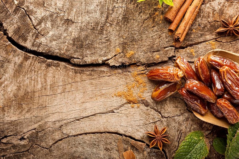 Top view dates cinnamon sticks