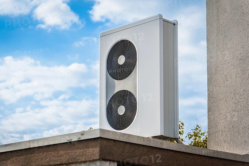 A heat pump on the roof of a garage in Langenfeld, Germany, Europe