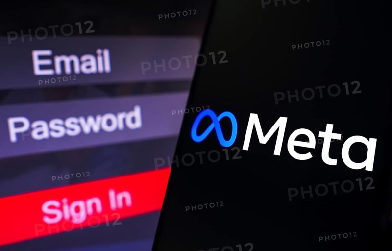In this photo illustration, the Meta Platforms logo is displayed on a smartphone screen, next to a login screen, with email, password and sign in