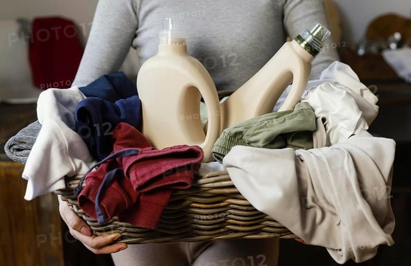 Woman holding laundry basket close up. Resolution and high quality beautiful photo