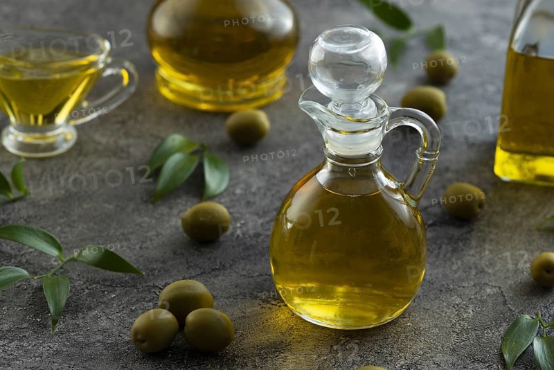 High view of bottles filled with olive oil on marble background Picture on pik. Resolution and high quality beautiful photo