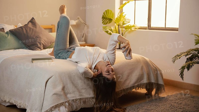 Woman using smartphone home bed. Resolution and high quality beautiful photo