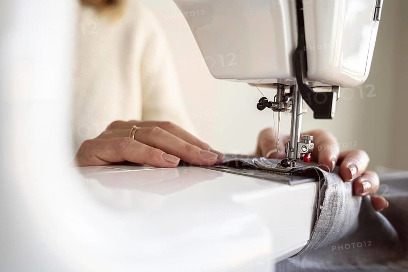 Close up person using sewing machine. Resolution and high quality beautiful photo