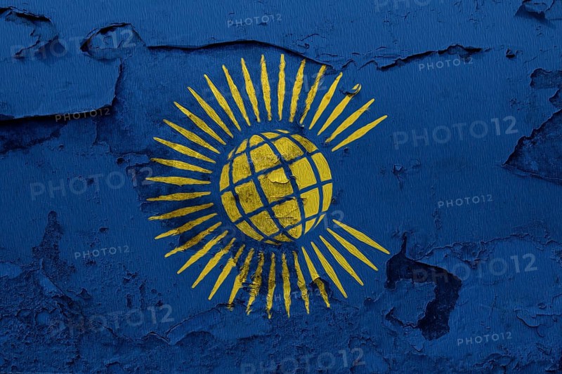 Commonwealth of Nations Flag painted on the cracked grunge concrete wall
