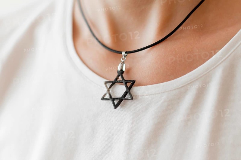 Front view person wearing david s star pendant