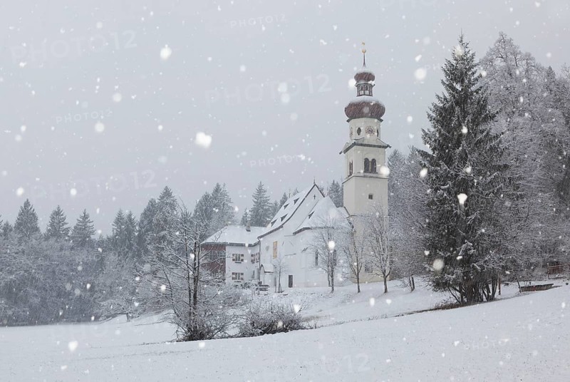 Church of St. Martin during snowfall, Gnadenwald, Tyrol, Austria, Europe