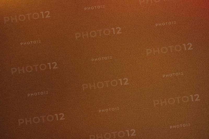 High grain photo of a warm brown gradient, ideal for backgrounds