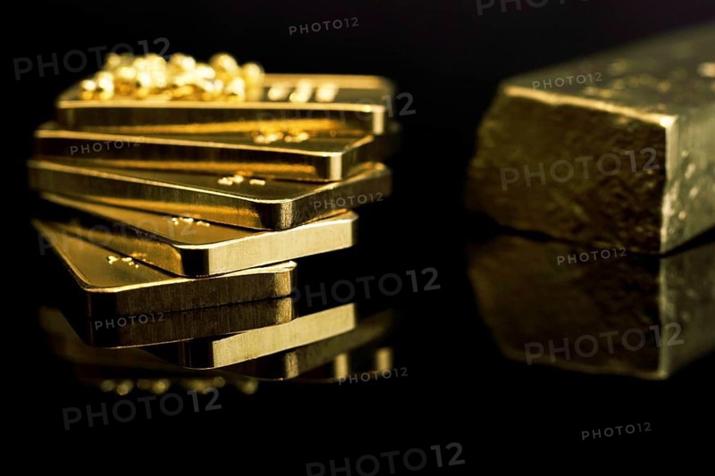 Gold bars 999 precious metal, black background