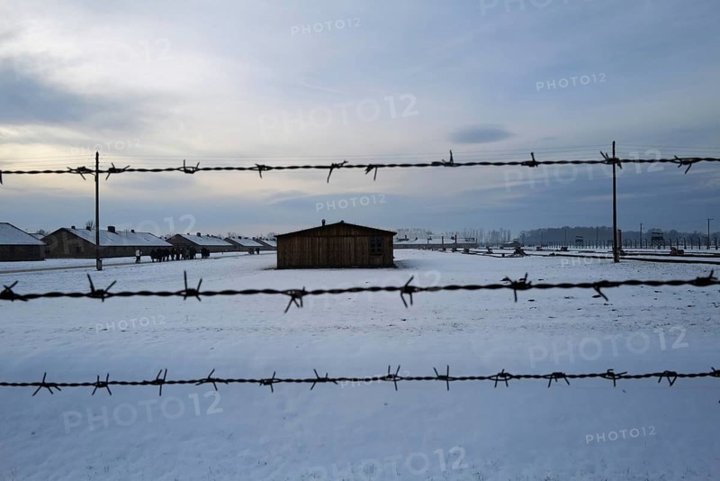 A view of barbed wire and huts i the Auschwitz-Birkenau camp. Auschwitz-Birkenau, Poland, Europe