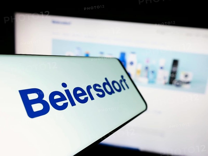 Stuttgart, Germany, 09-09-2023: Cellphone with logo of German consumer goods company Beiersdorf AG on screen in front of business website. Focus on center-left of phone display, Europe