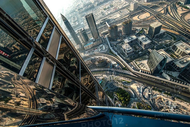 View from the great height of the Burj Khalifa of the modern architecture and skyline of Dubai with its streets and skyscrapers