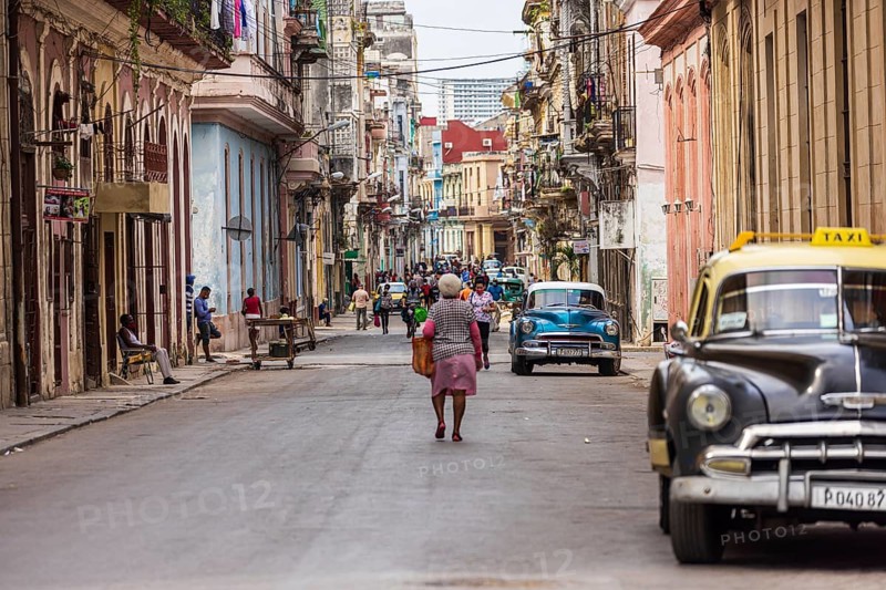 Street scene with vintage taxi car in the old part of the Havana