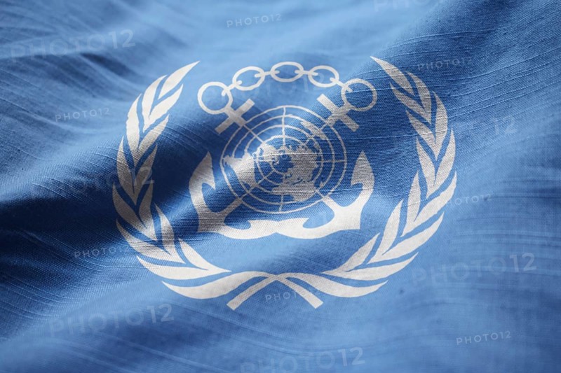 Closeup of Ruffled International Maritime Organization Flag, International Maritime Organization Flag Blowing in Wind