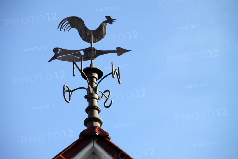 Weathercock on a roof in Lothe