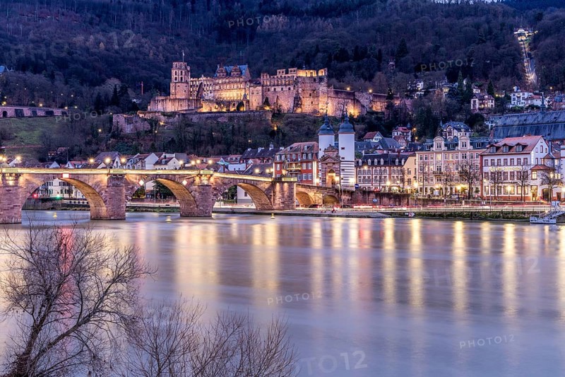 Night view of Heidelberg with illuminated castle and bridge over the Neckar, Old bridge in Heidelberg on the Neckar, Illuminated castle and bridge over the Neckar in an atmospheric night shot of Heidelberg