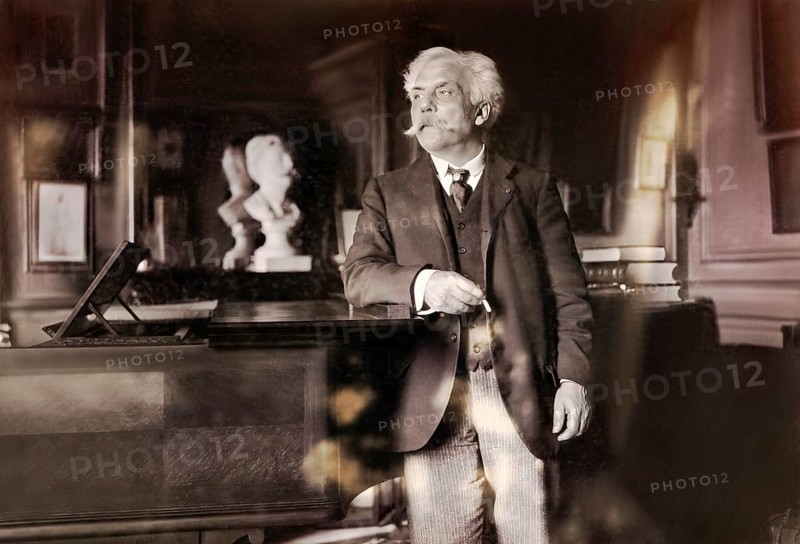 Gabriel Fauré, 1845 – 1924, French composer, next to his piano in his appartement, Boulevard Malesherbes, Paris, digitally edited according to a photograph by Dornac